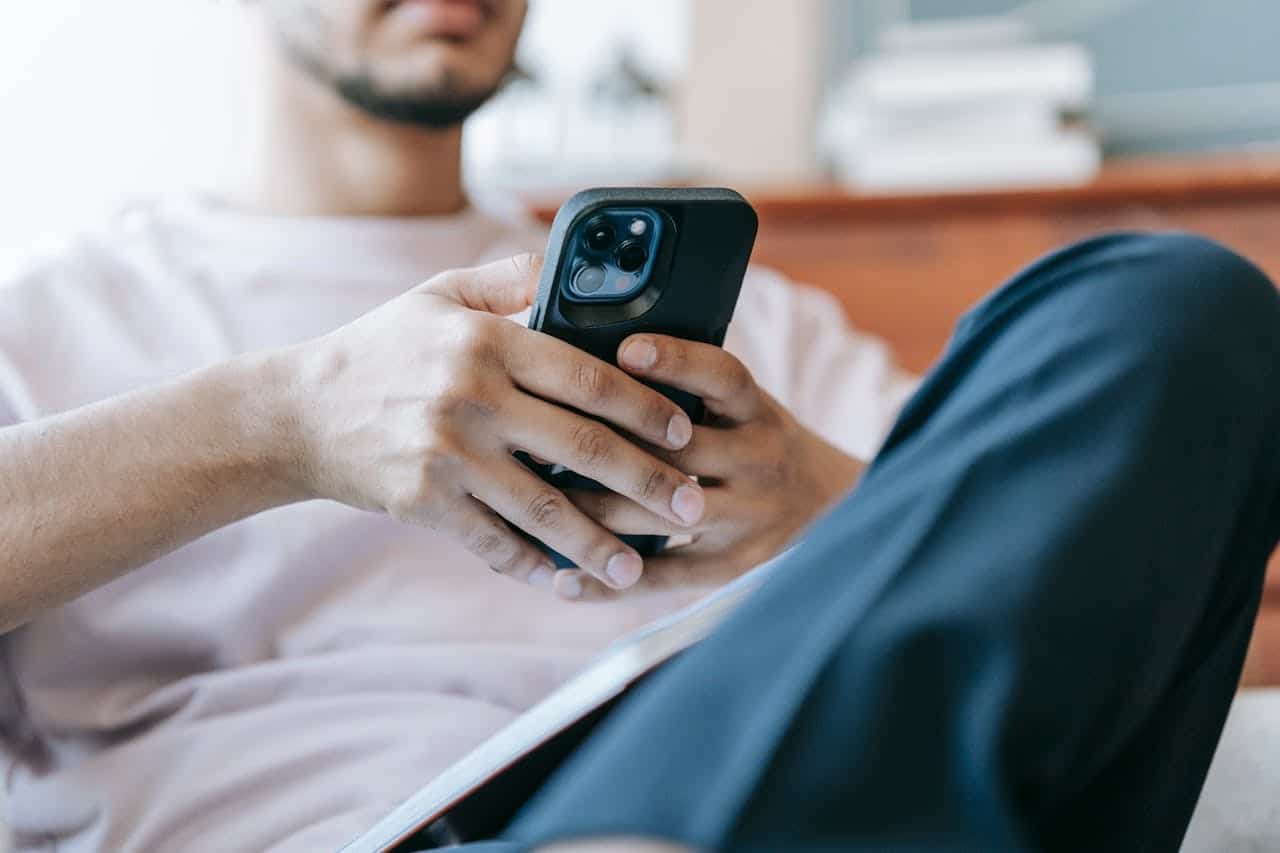 man texting phone