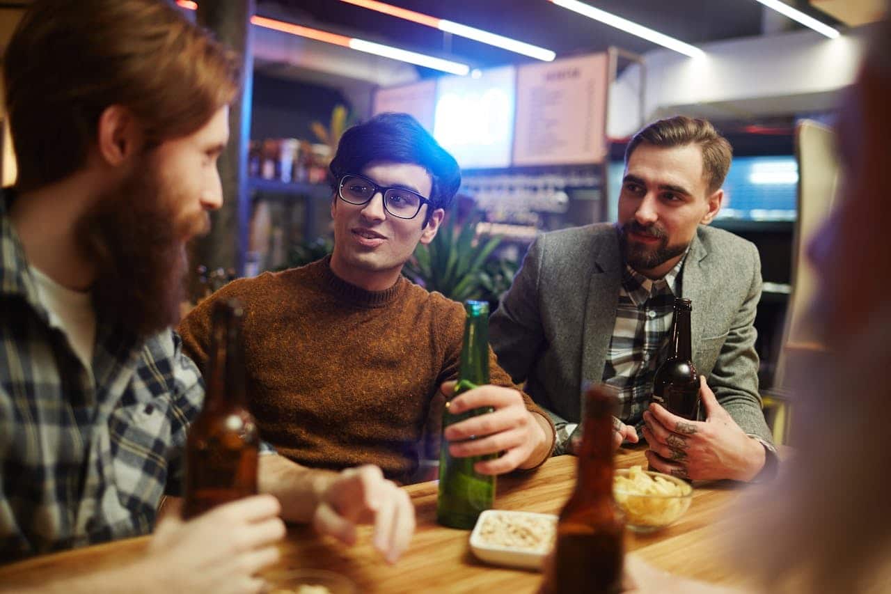 men talking outdoors