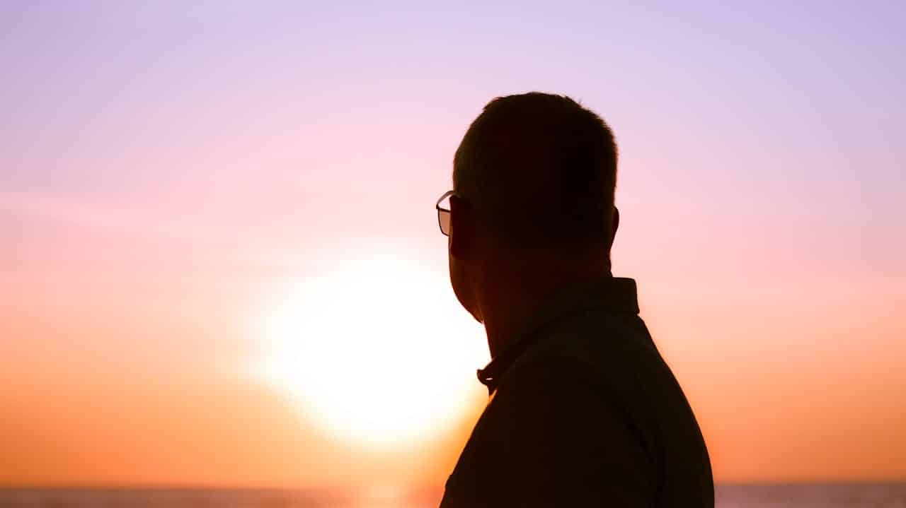 thoughtful man sunset