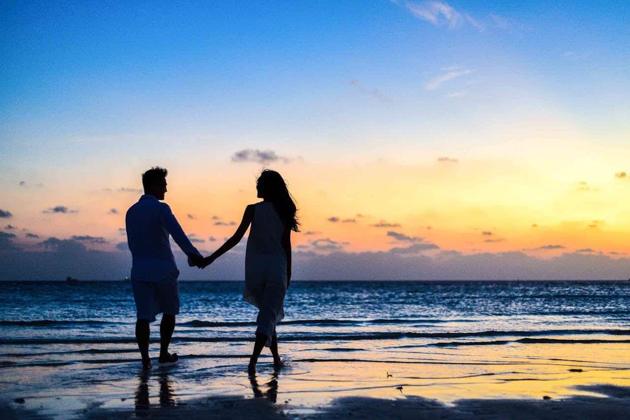 couple walking sunset