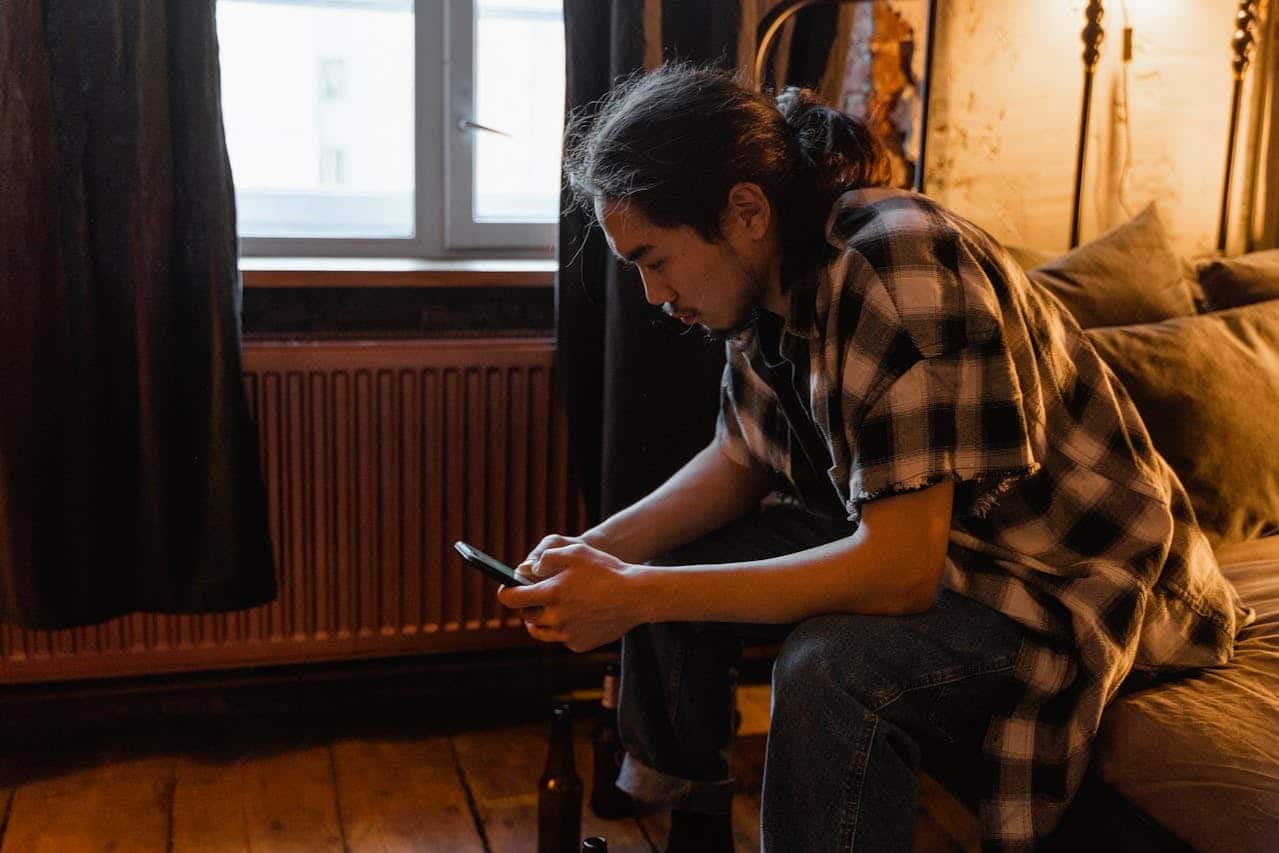 person using smartphone indoors