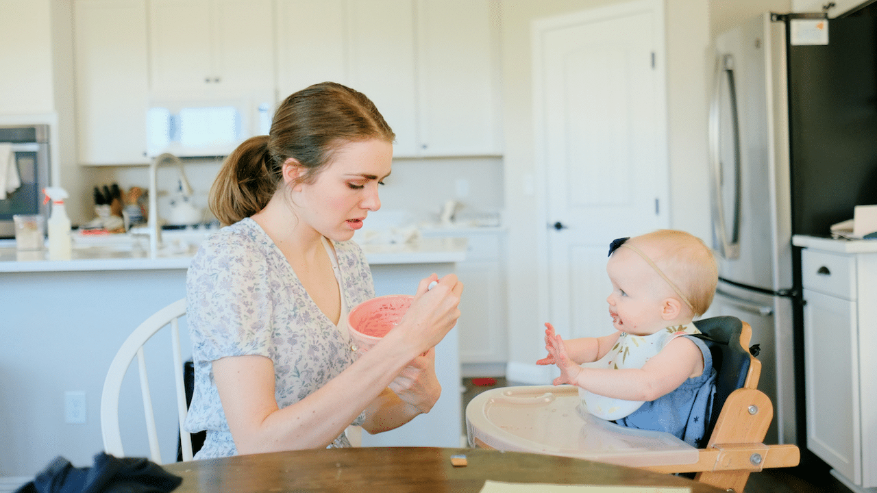 A mom feeding her baby