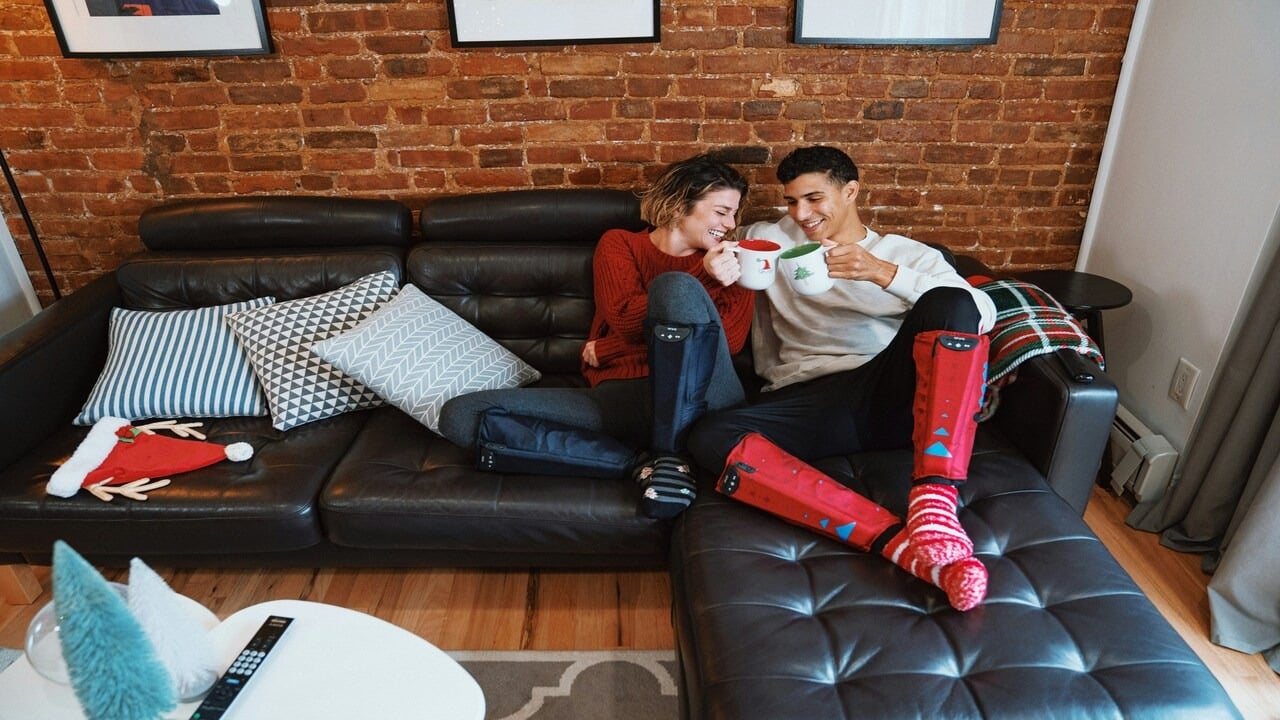 A couple having coffee on the couch
