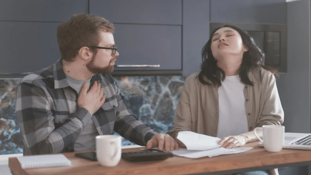 A couple looking stressed doing the bills