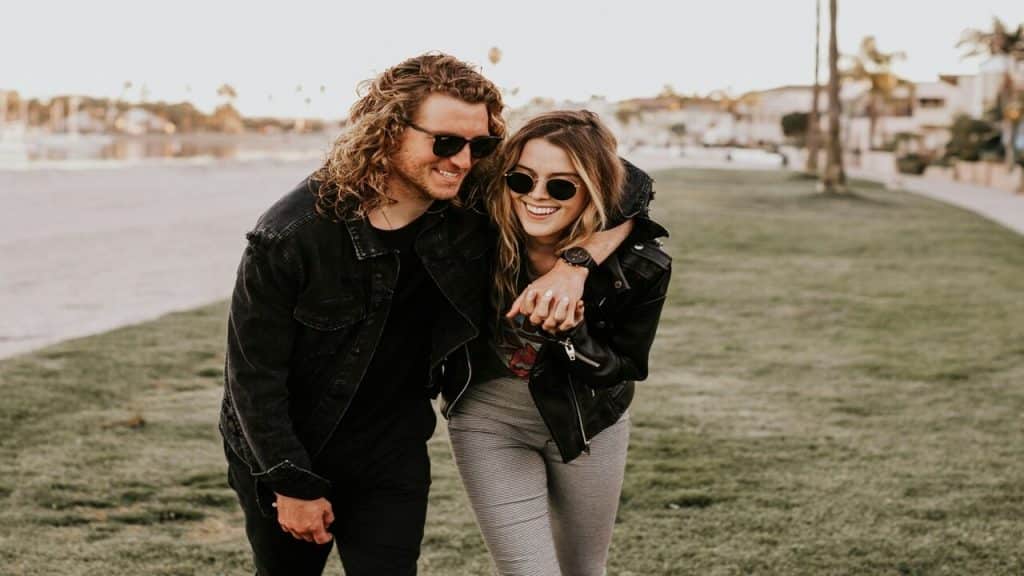 A couple laughing outdoors