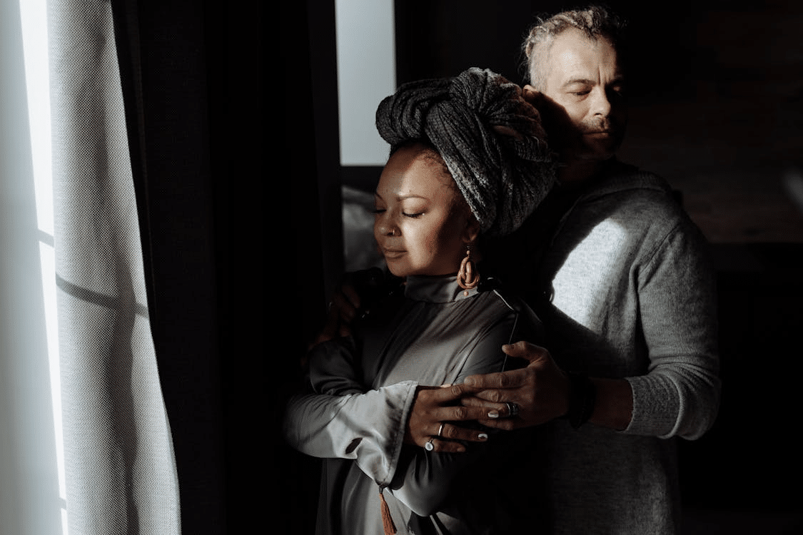 A man hugging a woman