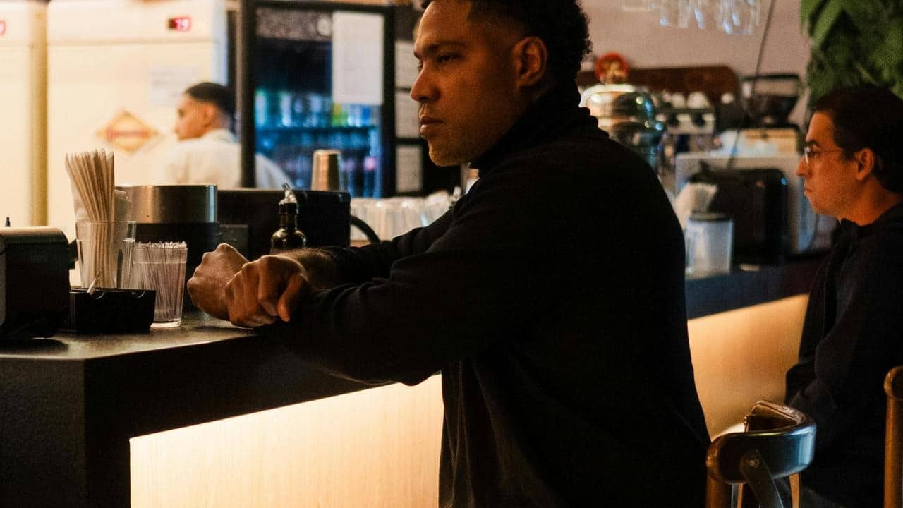 A man leaning on a counter