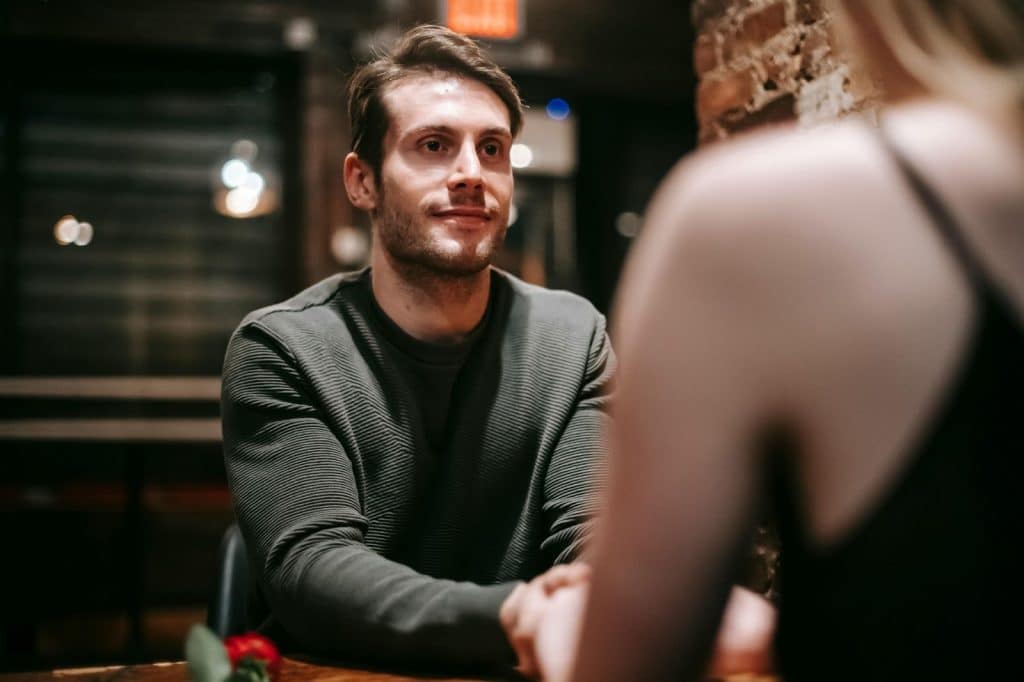A man listening to woman