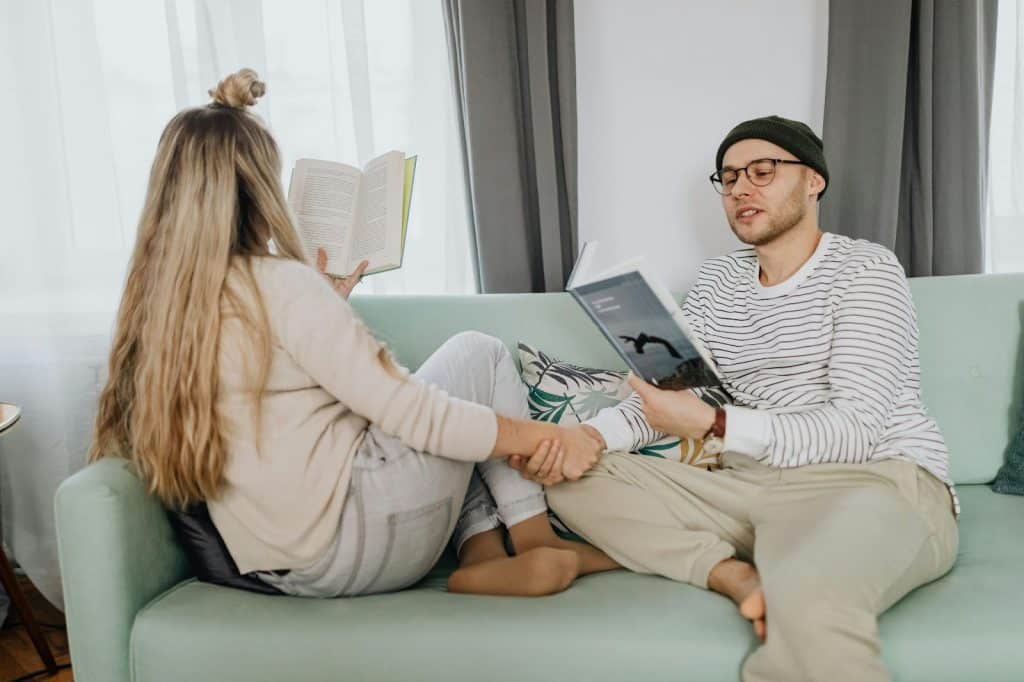A man and woman reading a book together