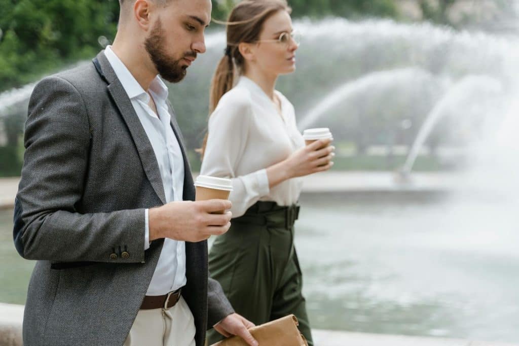 A man and woman walking to work