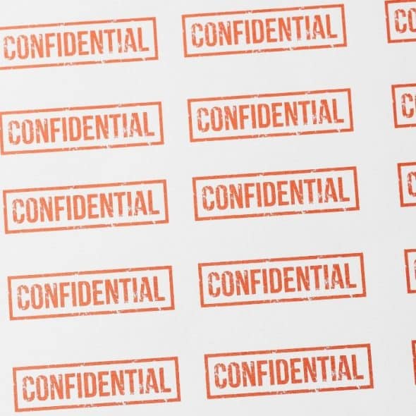 A white background covered in diagonal rows of red rectangular stamps with the word "CONFIDENTIAL."