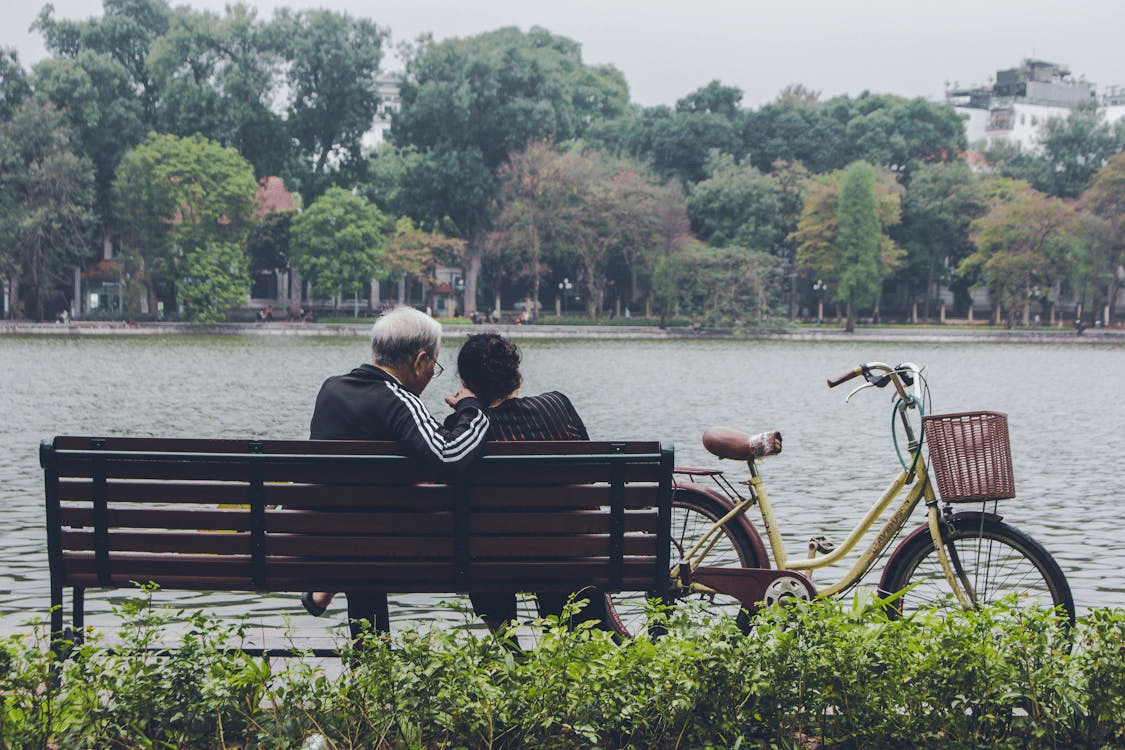 A couple sitting on a bench