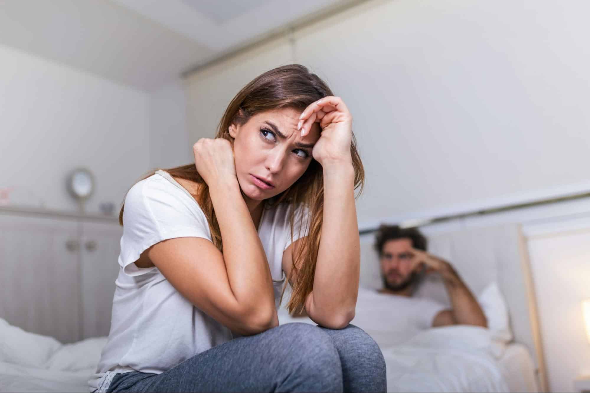 A man being silent behind the woman
