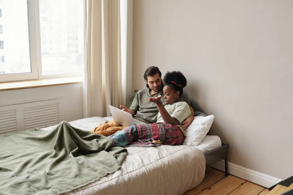 A couple lying on the bed