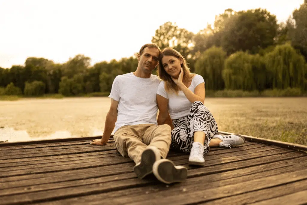 A couple sitting on a deck