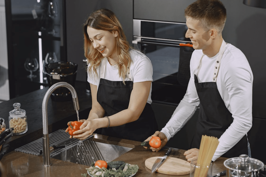 A man and a woman cooking together
