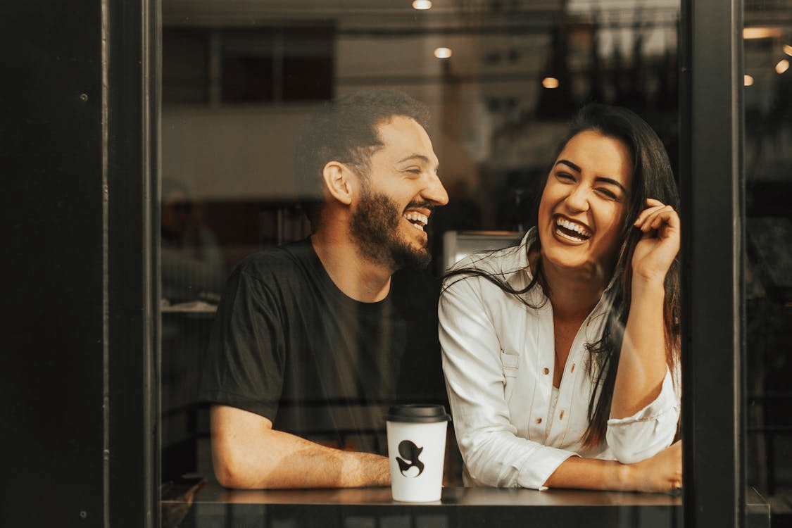 A man and a woman laughing together