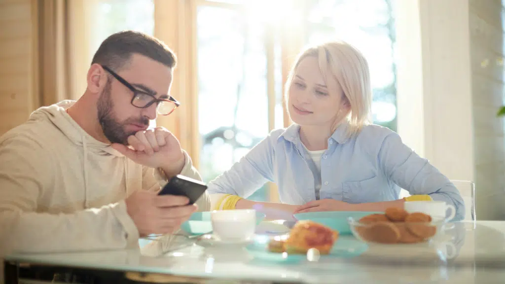 A woman listening to her husband talking about something