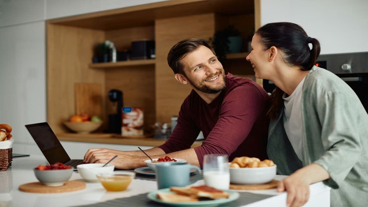 A couple smiling at each other