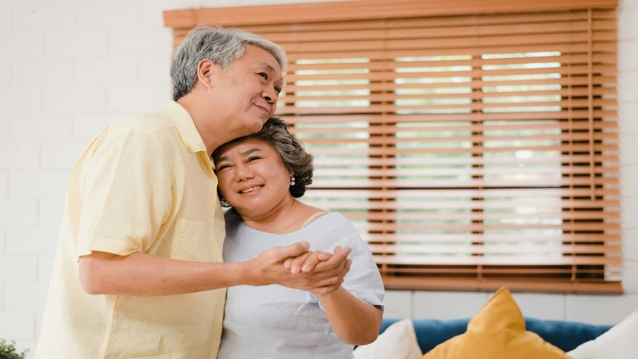 A couple dancing in the living room
