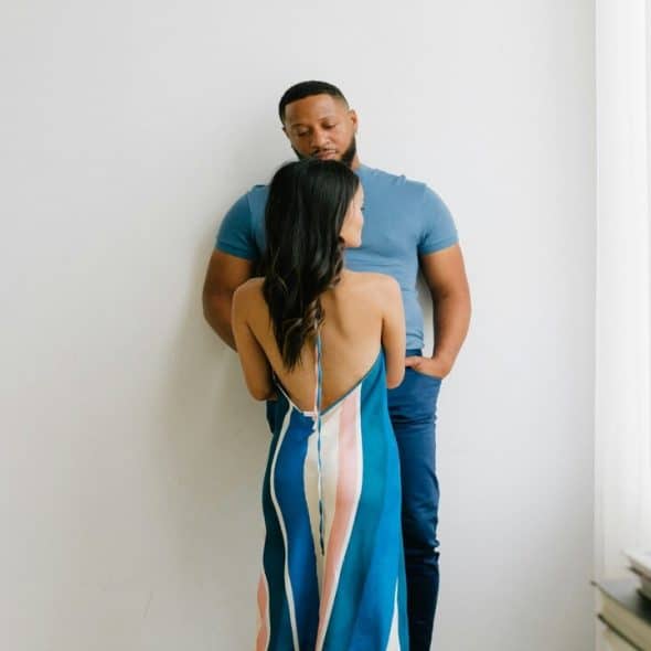 A couple looking sad in the living room