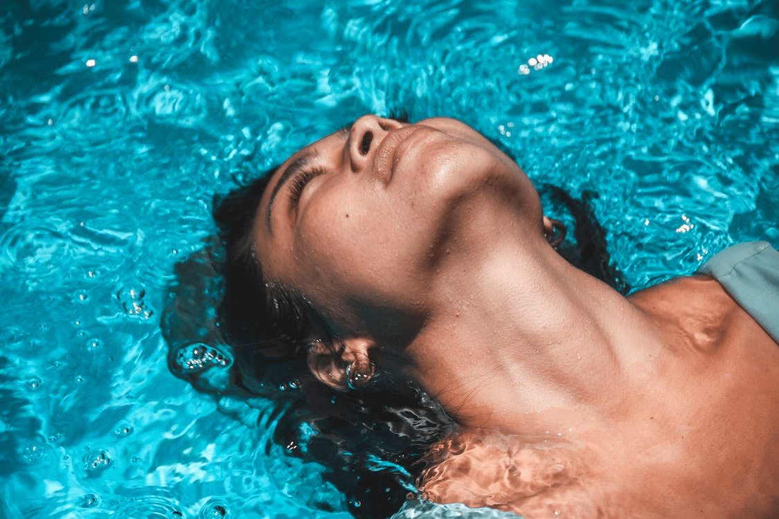 Relaxed Woman Swimming in a Pool