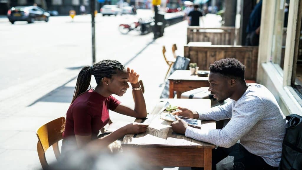 A couple in an outdoor cafe