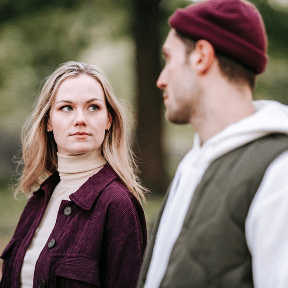 A serious couple looking at each other
