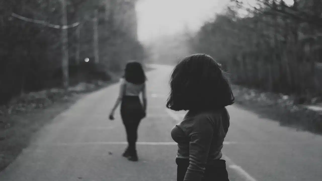 A woman looking at another woman