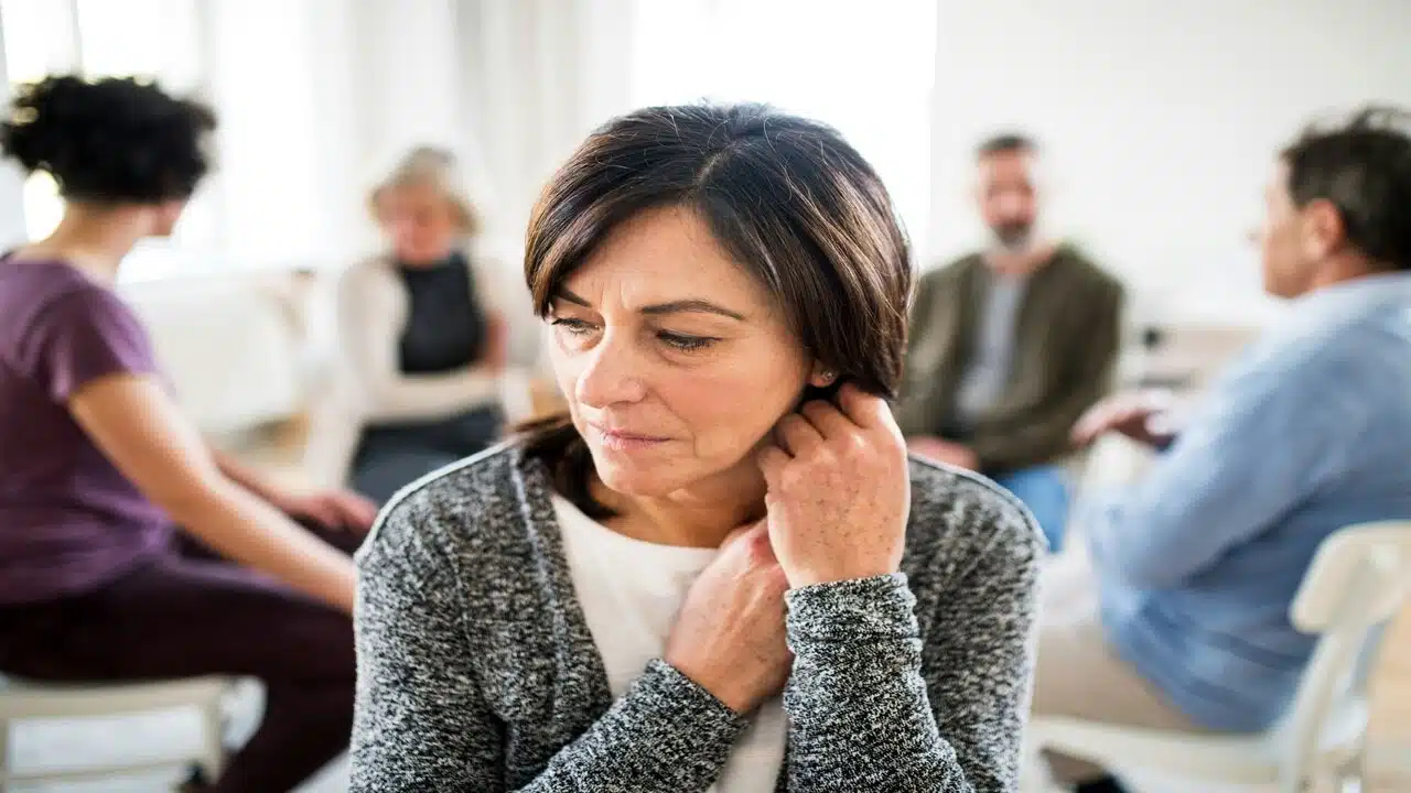 A mature woman in group therapy