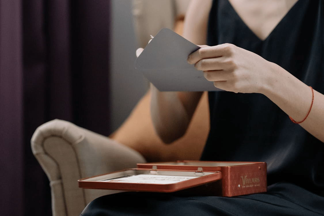 A woman opening an envelope
