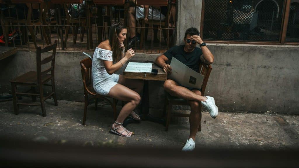 A man looking uninterested with their date