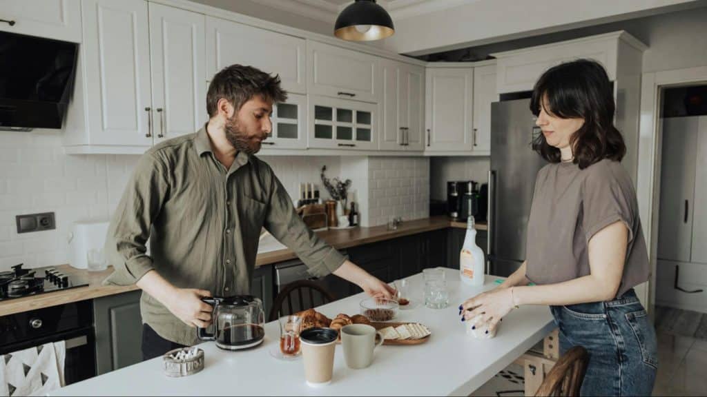 A man and woman at the kitchen