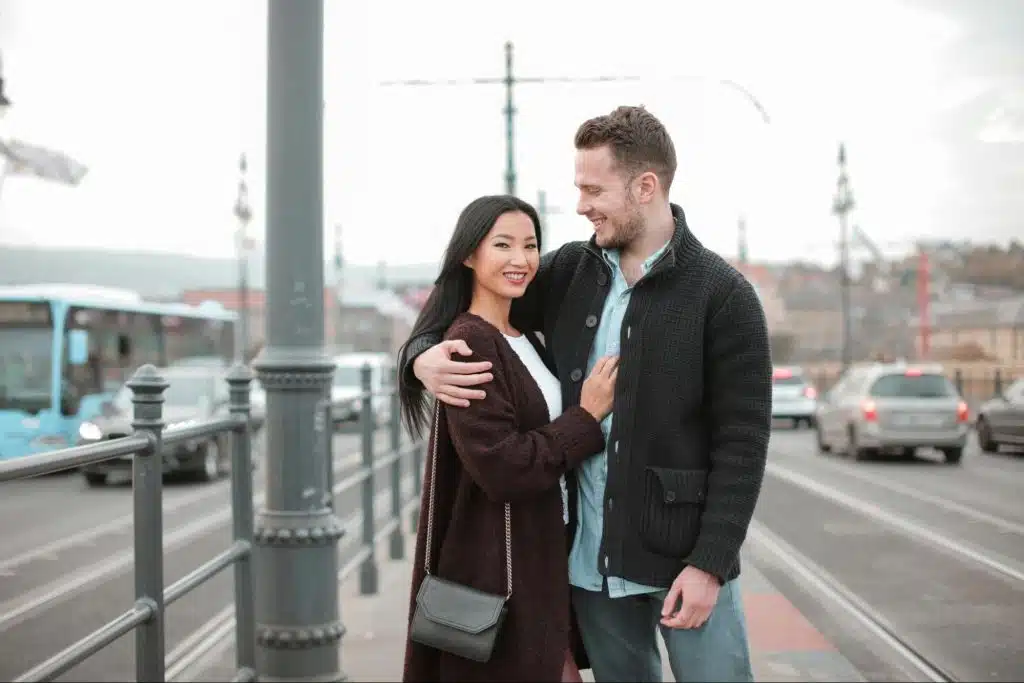 A man embracing woman