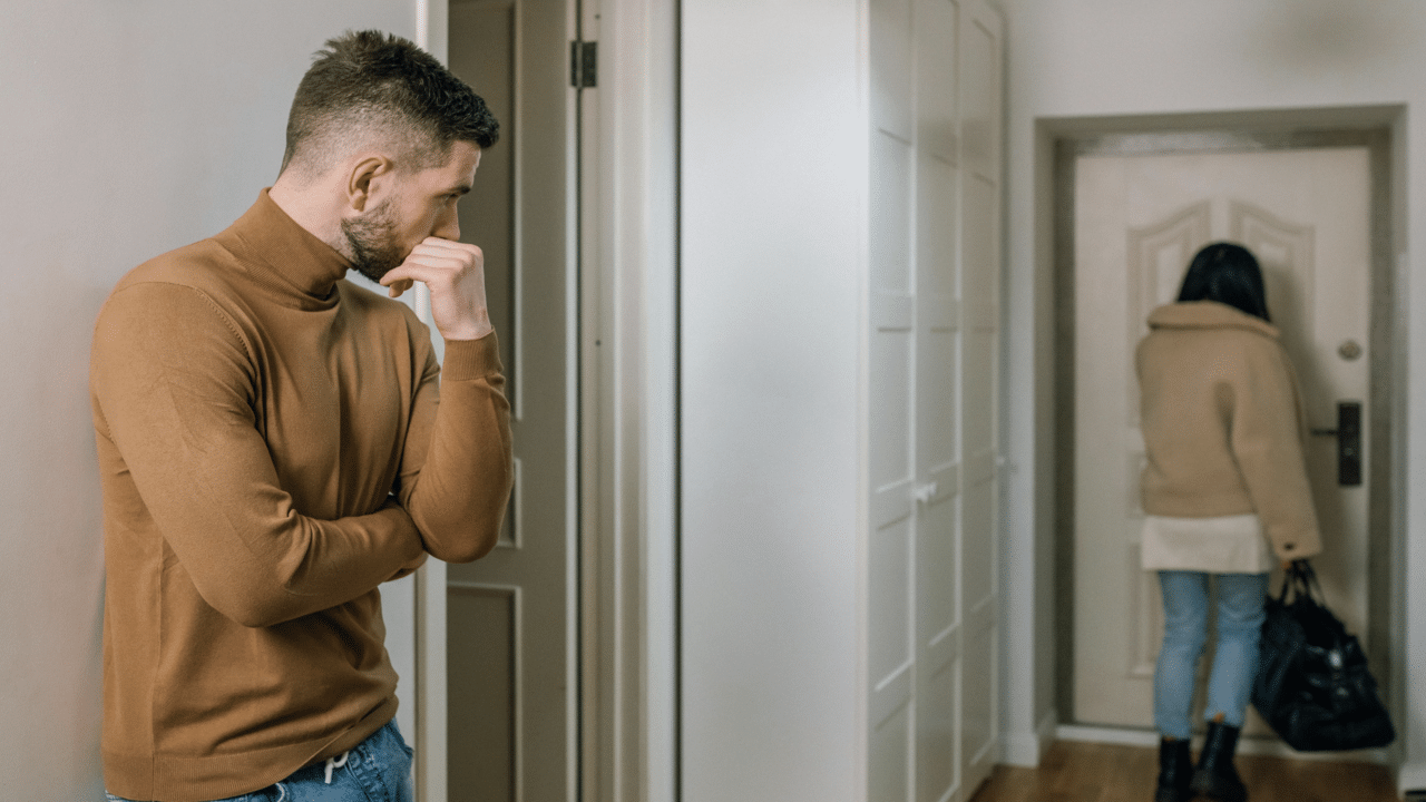 A man watching his wife walk away