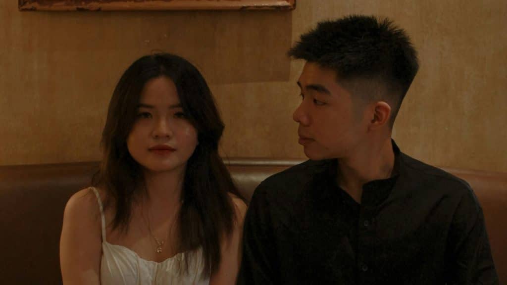 A man looks at a woman.