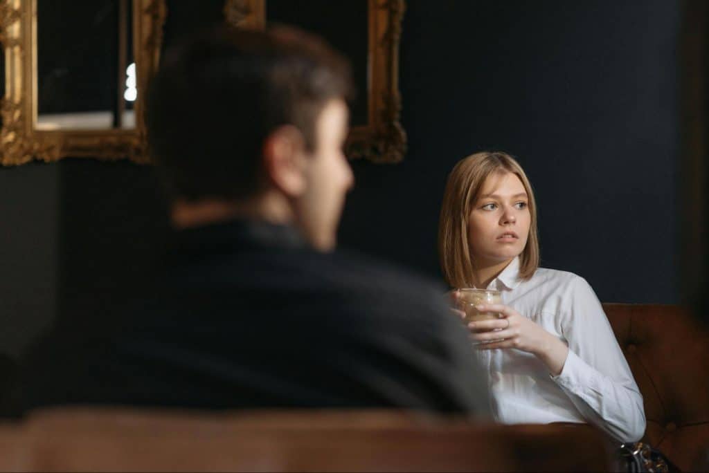 A man and woman looking at something