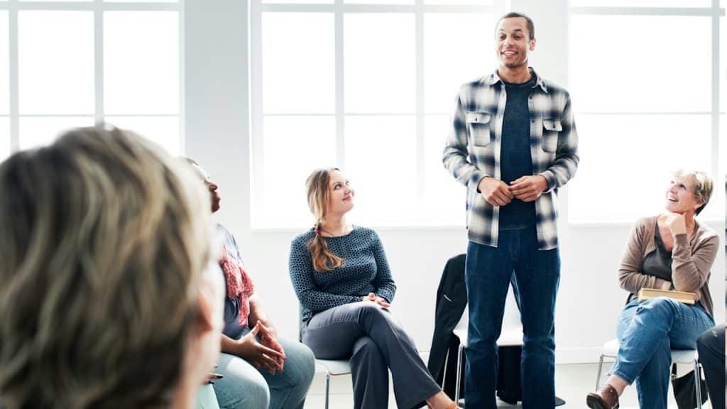 A man presenting his ideas in front of his team.