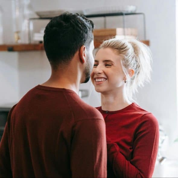 A man and a woman facing each other