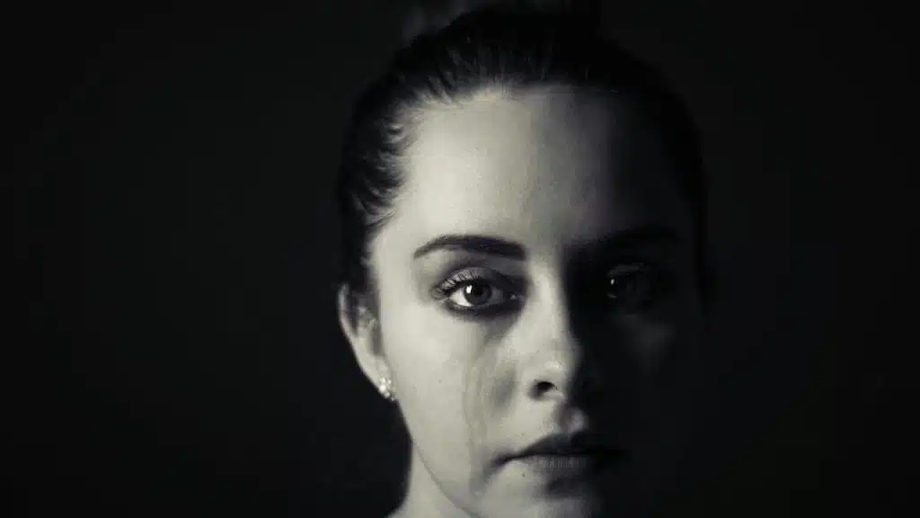 A closeup of a woman crying.