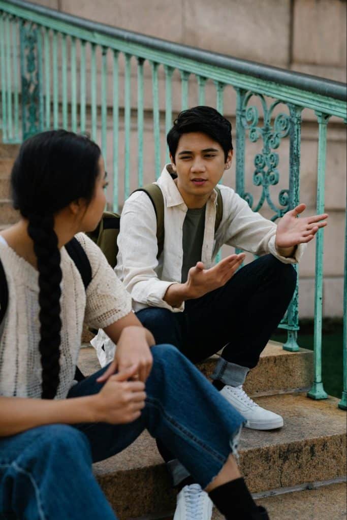A man explaining to woman