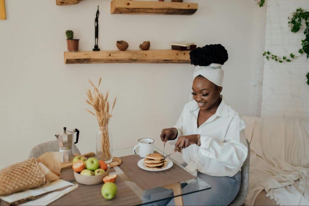 Woman smiling while eating
