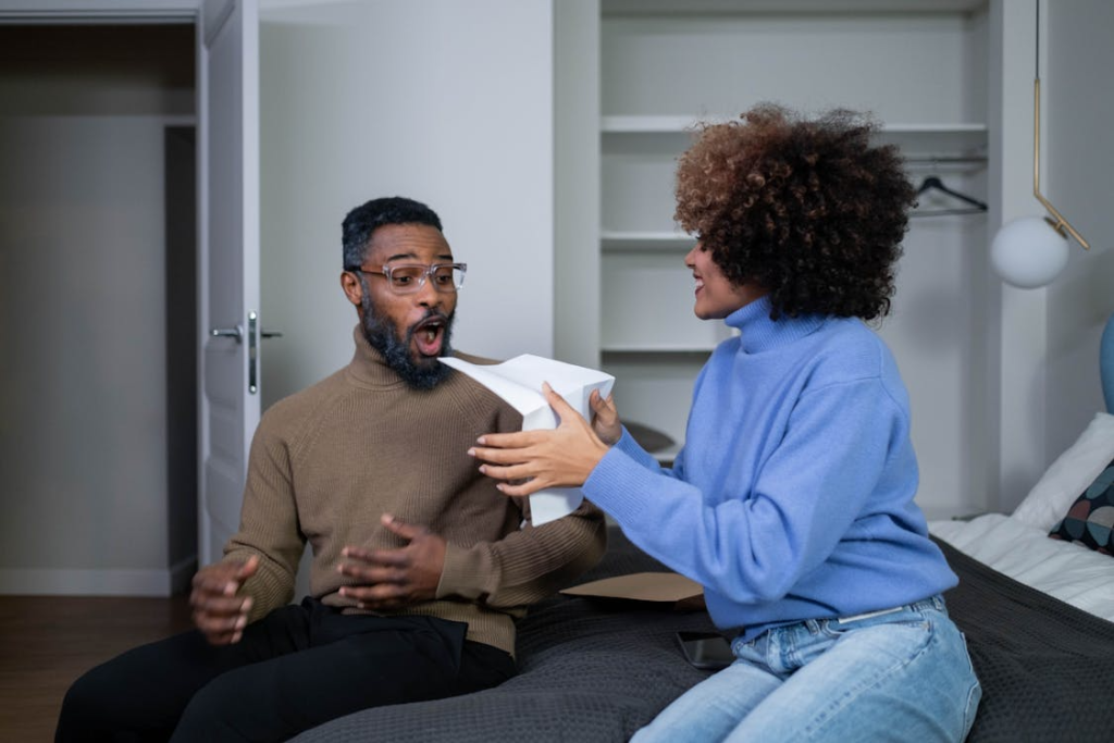 A Woman in Blue Sweater Sitting beside a Man in Brown Sweater