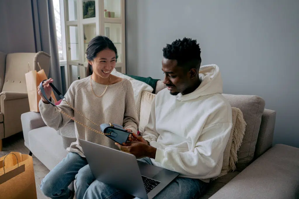 Couple on a couch, bonding and smiling