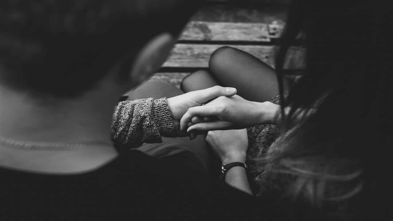 A couple holding hands