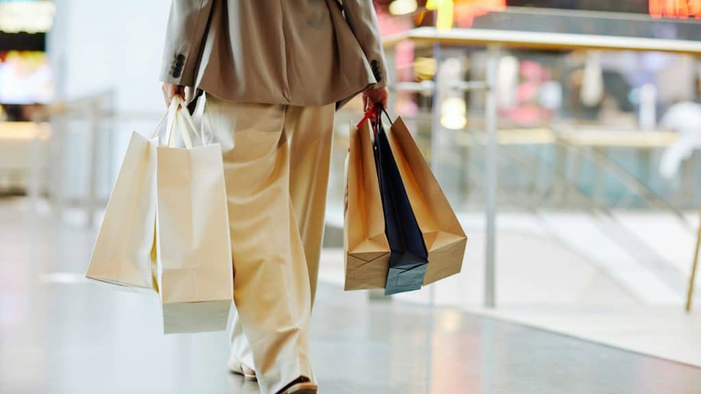 A person carrying shopping bags.