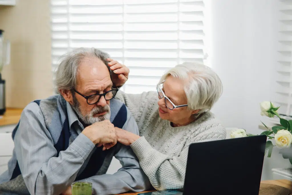Senior woman taking care of husband