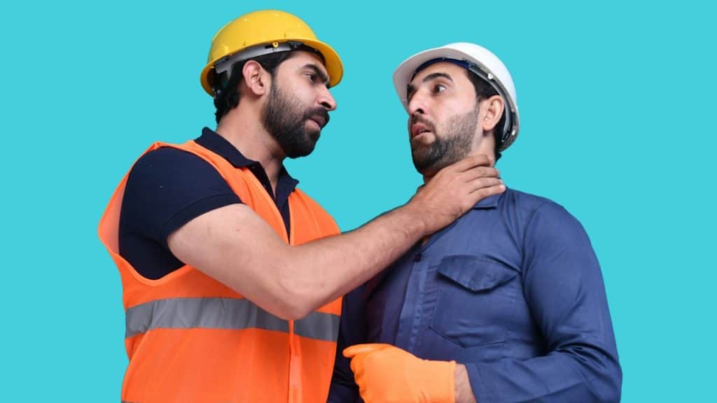 A man pressing throat of his colleague.
