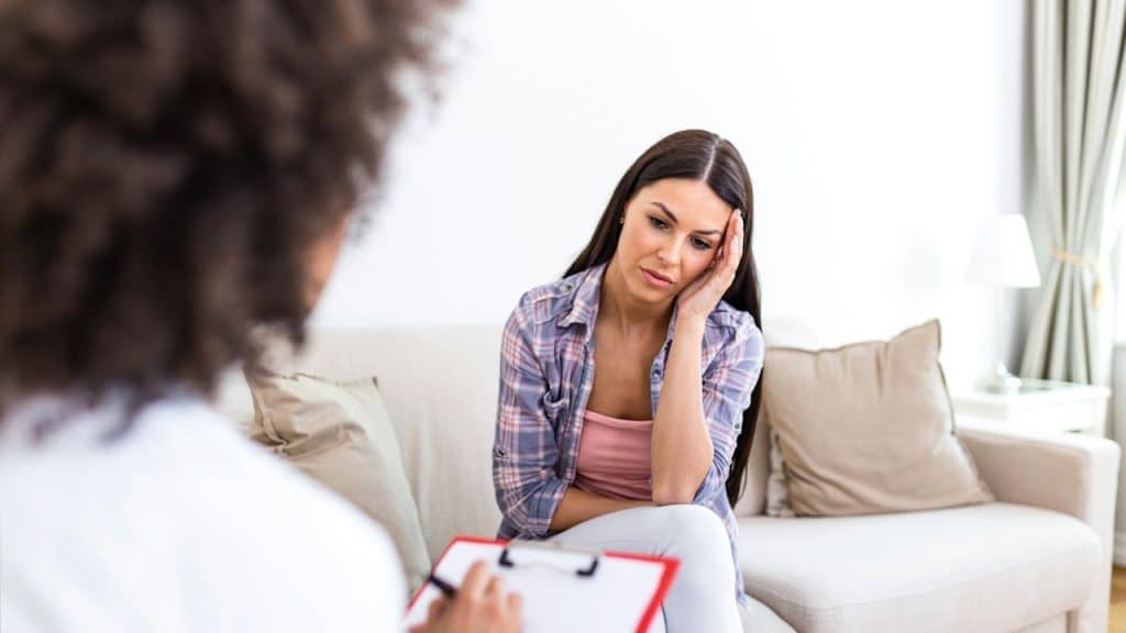 A woman taking a session wy her clinic.