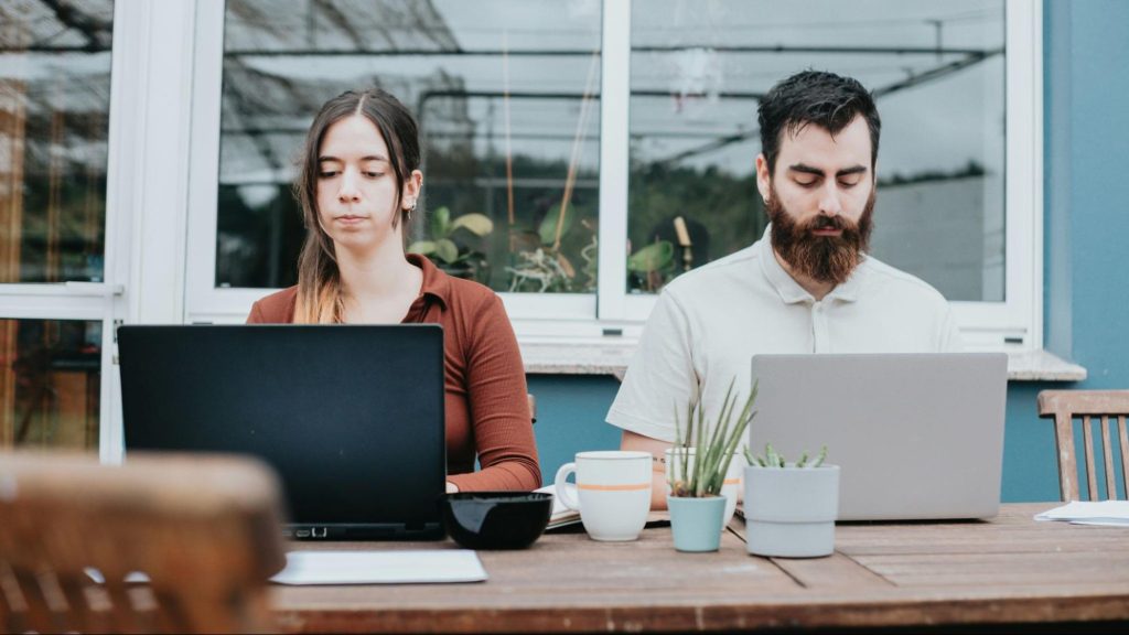 A man and woman busy working